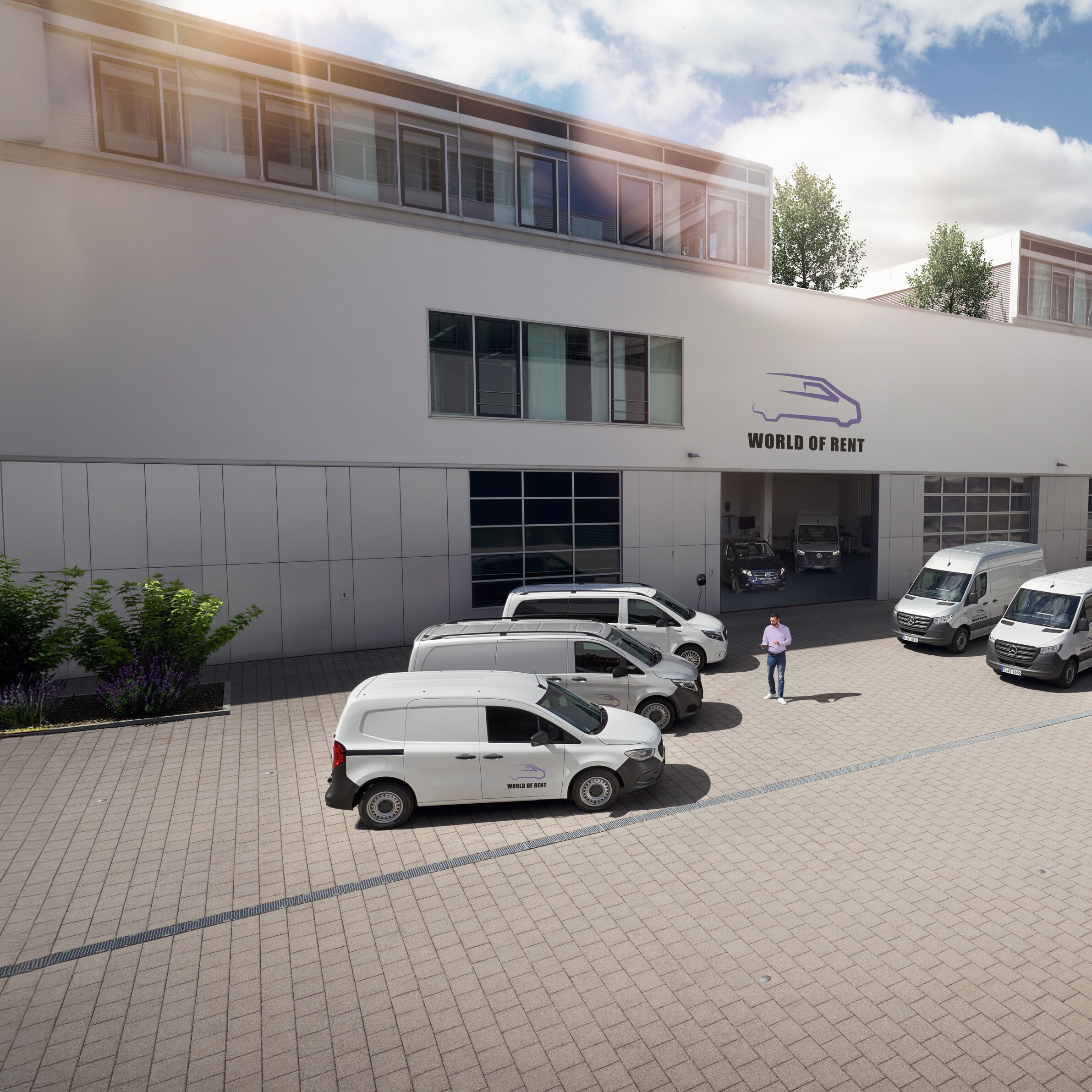 Een wagenpark met Mercedes-Benz voertuigen voor een bedrijfsgebouw.